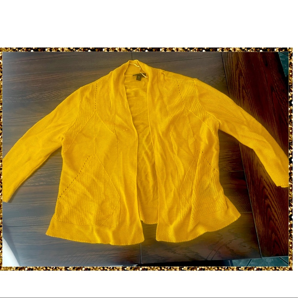 This is a mustard colored cardigan. It is an XL.